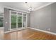 Dining room with hardwood floors, chandelier, and large window at 1215 Comet View Se Trl, Smyrna, GA 30082