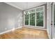 Dining room featuring a chandelier, hardwood floors and large window at 1215 Comet View Se Trl, Smyrna, GA 30082