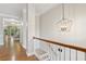 Hallway view features hardwood floors, a chandelier and stairs at 1215 Comet View Se Trl, Smyrna, GA 30082