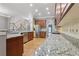 Spacious kitchen boasts granite countertops, stainless steel appliances, and hardwood flooring at 1215 Comet View Se Trl, Smyrna, GA 30082