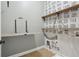 Functional laundry room features a folding table, wall shelves, and black and white striped wallpaper at 1215 Comet View Se Trl, Smyrna, GA 30082