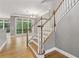 Living room features a staircase, hardwood floors, and large windows at 1215 Comet View Se Trl, Smyrna, GA 30082