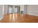 Bright living room featuring hardwood floors, fireplace, and door to balcony at 1215 Comet View Se Trl, Smyrna, GA 30082