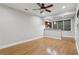 Living room featuring hardwood flooring, a ceiling fan, and a bar area at 1215 Comet View Se Trl, Smyrna, GA 30082