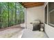 Outdoor patio with natural gas grill overlooking mature trees at 1215 Comet View Se Trl, Smyrna, GA 30082