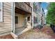 View of the patio from below a balcony with easy access to the outside at 1215 Comet View Se Trl, Smyrna, GA 30082