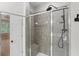 Walk-in shower featuring gray tile and a built in shower bench at 1215 Comet View Se Trl, Smyrna, GA 30082