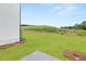 Expansive backyard with lush green lawn and views of natural greenery at 208 Sharon Ln, Loganville, GA 30052