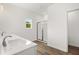 Bright bathroom featuring a double sink vanity with modern fixtures and a glass-enclosed shower at 208 Sharon Ln, Loganville, GA 30052