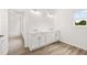 Bright bathroom featuring a double sink vanity with modern fixtures at 208 Sharon Ln, Loganville, GA 30052