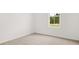 Bedroom with natural light from a window and neutral carpet at 208 Sharon Ln, Loganville, GA 30052