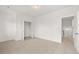 Spacious bedroom with neutral carpet and adjacent walk-in closet at 208 Sharon Ln, Loganville, GA 30052