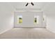 Open, airy bedroom featuring neutral walls, carpet and tray ceiling with fan at 208 Sharon Ln, Loganville, GA 30052