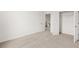 Bedroom with neutral carpet and two closet doors at 208 Sharon Ln, Loganville, GA 30052