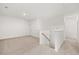 Upstairs bonus room with plush carpeting and staircase access at 208 Sharon Ln, Loganville, GA 30052