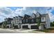 Beautifully designed townhomes featuring private garages, modern architecture and manicured landscaping at 208 Sharon Ln, Loganville, GA 30052