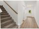 Hallway features stairs and durable floors at 208 Sharon Ln, Loganville, GA 30052