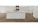 Modern kitchen island with stainless steel sink, white cabinets, and modern appliances at 208 Sharon Ln, Loganville, GA 30052