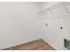 Functional laundry room with hard surface floors and a wire shelf for storage at 208 Sharon Ln, Loganville, GA 30052
