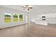 Open-concept layout features the kitchen with island at 208 Sharon Ln, Loganville, GA 30052