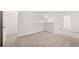 Spacious upstairs loft area featuring neutral carpet and a half-wall leading to the staircase at 208 Sharon Ln, Loganville, GA 30052