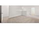 Light-filled upstairs landing area with carpet flooring and white doors at 208 Sharon Ln, Loganville, GA 30052