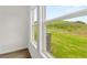 Bright window view to a lush green lawn and natural greenery at 208 Sharon Ln, Loganville, GA 30052
