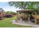 This backyard features a covered gazebo with seating and a grill, perfect for outdoor gatherings at 435 Trammell Dr, Alpharetta, GA 30009