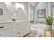 This bathroom features a soaking tub, double sinks, and modern lighting at 435 Trammell Dr, Alpharetta, GA 30009