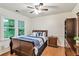 Cozy bedroom with hardwood floors, natural light, and comfortable furnishings at 435 Trammell Dr, Alpharetta, GA 30009