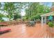 Enjoy outdoor dining on this spacious deck, perfect for entertaining with lush greenery at 435 Trammell Dr, Alpharetta, GA 30009