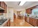 Well-appointed kitchen with granite countertops, stainless steel appliances, and hardwood flooring at 435 Trammell Dr, Alpharetta, GA 30009