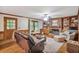 Comfortable living room with fireplace, built-in shelving, and hardwood floors at 435 Trammell Dr, Alpharetta, GA 30009
