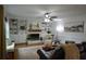 Cozy living room featuring a brick fireplace, built-in shelving, and comfortable seating at 435 Trammell Dr, Alpharetta, GA 30009