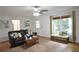 Bright living room featuring a decorative rug, bench seating, and ample natural light at 435 Trammell Dr, Alpharetta, GA 30009