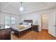 Main bedroom with tray ceiling, hardwood floors, and plenty of natural light at 435 Trammell Dr, Alpharetta, GA 30009