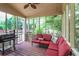 Screened in porch with comfortable seating, perfect for outdoor living at 435 Trammell Dr, Alpharetta, GA 30009