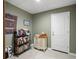 Finished basement with tiled floors, storage, and shelving for books and decorations at 55 Cross Pointe Ct, Hiram, GA 30141