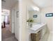 Bathroom with neutral colors and white cabinets, as well as view to the carpeted main bedroom at 55 Cross Pointe Ct, Hiram, GA 30141