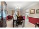 Formal dining room featuring a chandelier, and a wooden table and chairs at 55 Cross Pointe Ct, Hiram, GA 30141