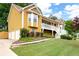 Charming two-story home featuring a welcoming front porch, landscaped yard, and a warm, inviting facade at 55 Cross Pointe Ct, Hiram, GA 30141