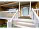 Close-up of the front porch featuring the front door, white railings, and welcoming details at 55 Cross Pointe Ct, Hiram, GA 30141