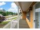 View from the front porch featuring the front door, white railings, and neighborhood view at 55 Cross Pointe Ct, Hiram, GA 30141