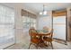 Cozy kitchen with wooden table and chairs, white appliances, and large window at 55 Cross Pointe Ct, Hiram, GA 30141