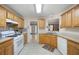 Kitchen with stainless steel appliances, wood cabinets, and tile backsplash at 55 Cross Pointe Ct, Hiram, GA 30141