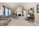 Spacious living room with vaulted ceilings, fireplace, tile flooring, and lots of natural light at 55 Cross Pointe Ct, Hiram, GA 30141