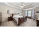 Spacious main bedroom featuring a tray ceiling, carpeted floors, and large windows at 55 Cross Pointe Ct, Hiram, GA 30141