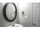 Well lit powder room with vessel sink, decorative mirror and stylish fixtures at 601 Hexham Ct, Suwanee, GA 30024