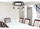 Dining room featuring a modern light fixture, classic decor, and comfortable seating at 601 Hexham Ct, Suwanee, GA 30024