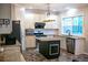 Modern kitchen with stainless steel appliances, granite countertops, and a central island at 601 Hexham Ct, Suwanee, GA 30024
